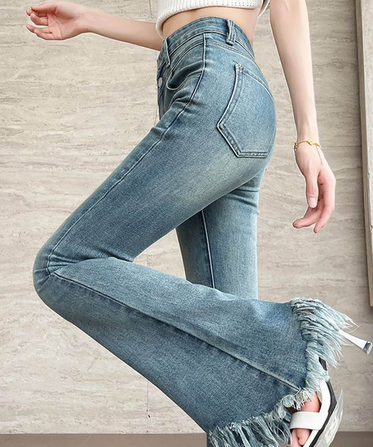 フリンジ裾加工フレアデニムパンツ